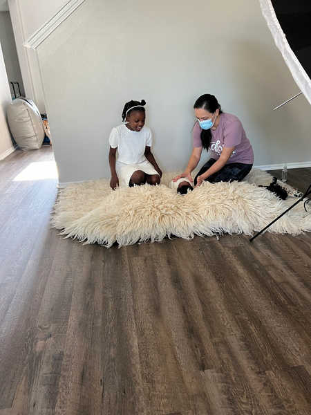 Lissette g wearing a mask and getting the photoshoot environemnt ready